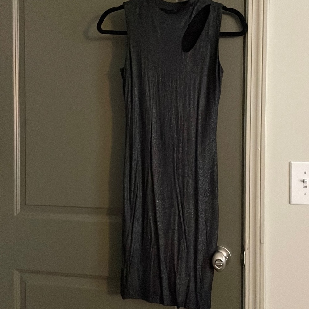 Small black metallic dress with shoulder cutout.